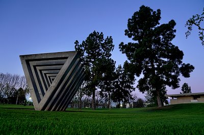 The Sweet Sixteen monument before sunrise outside the Conley Art Building.