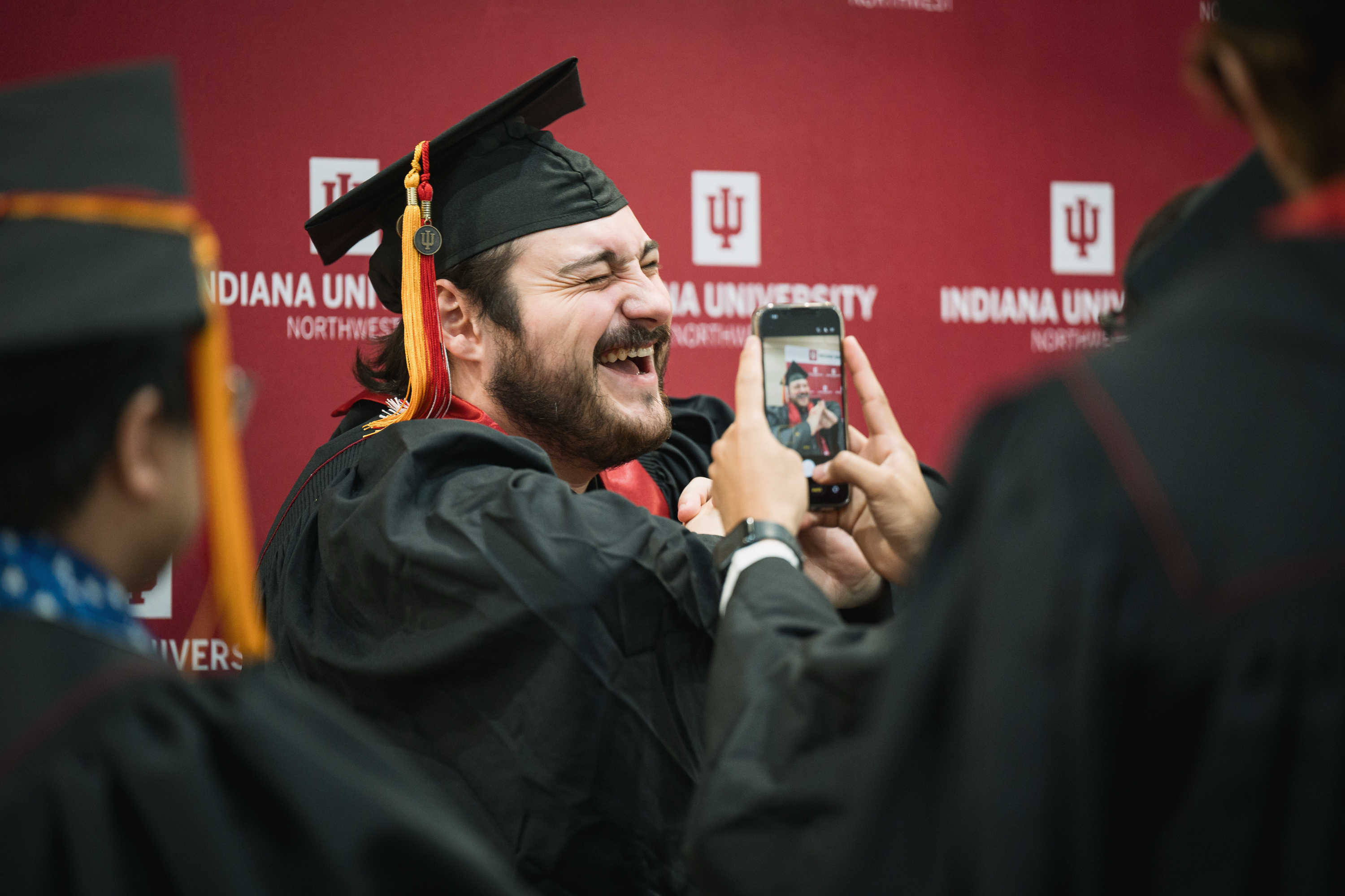 A graduate reacts before the IU Northwest Commencement in Gary on ...