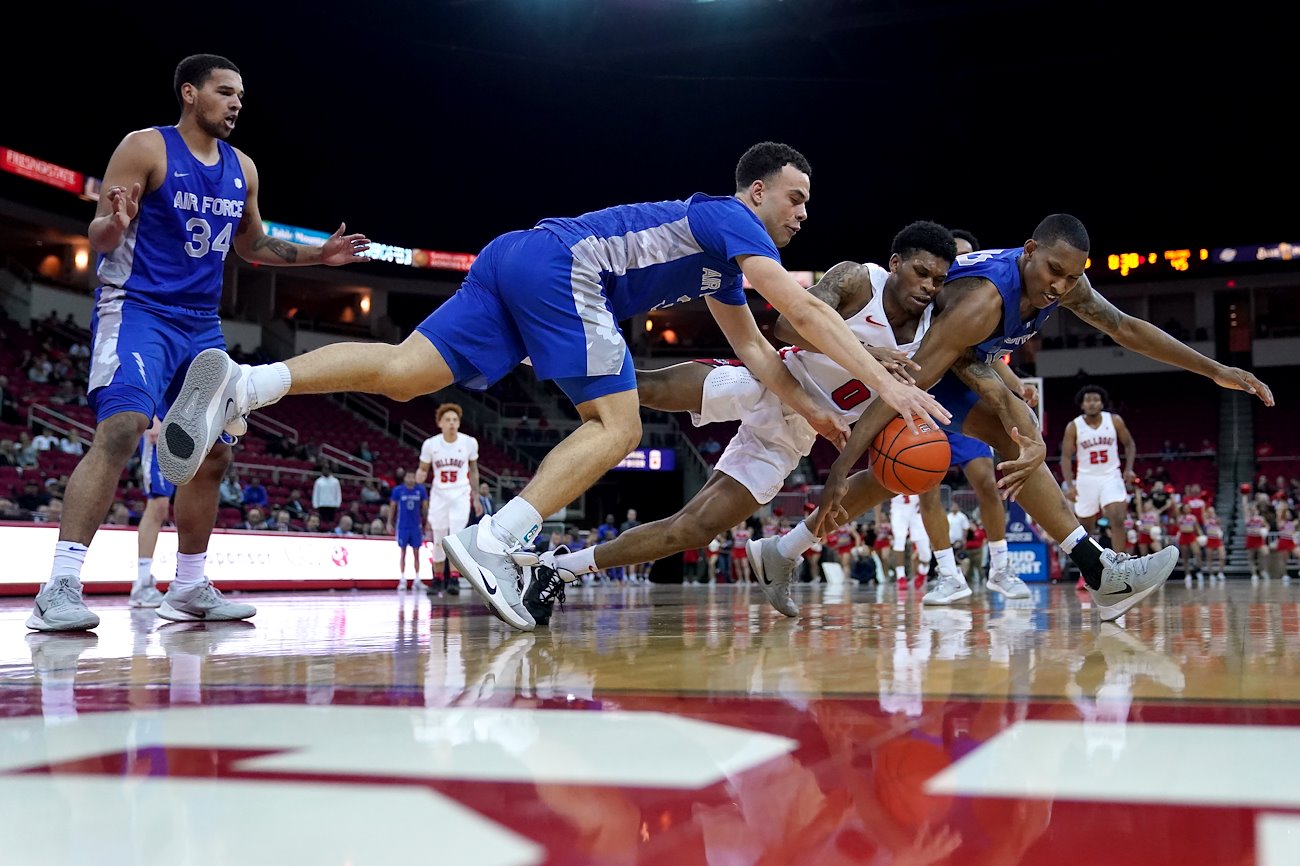 Guard New Williams dives for a loose ball during a game against Air Force on February 19, 2020.