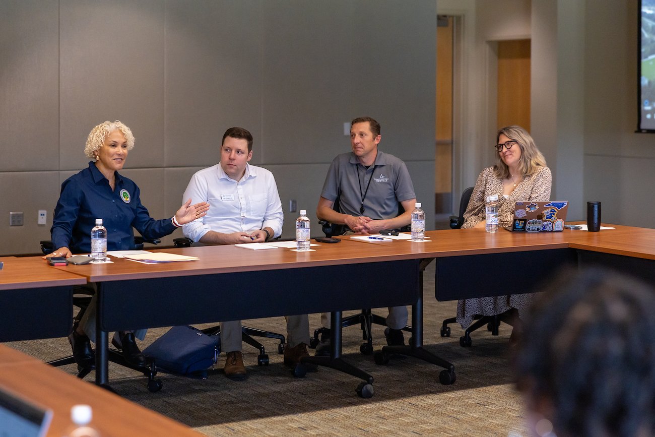 Ingrid Valentine (far left), deputy chief compliance officer for the Department of Education met with UNC Asheville staff.