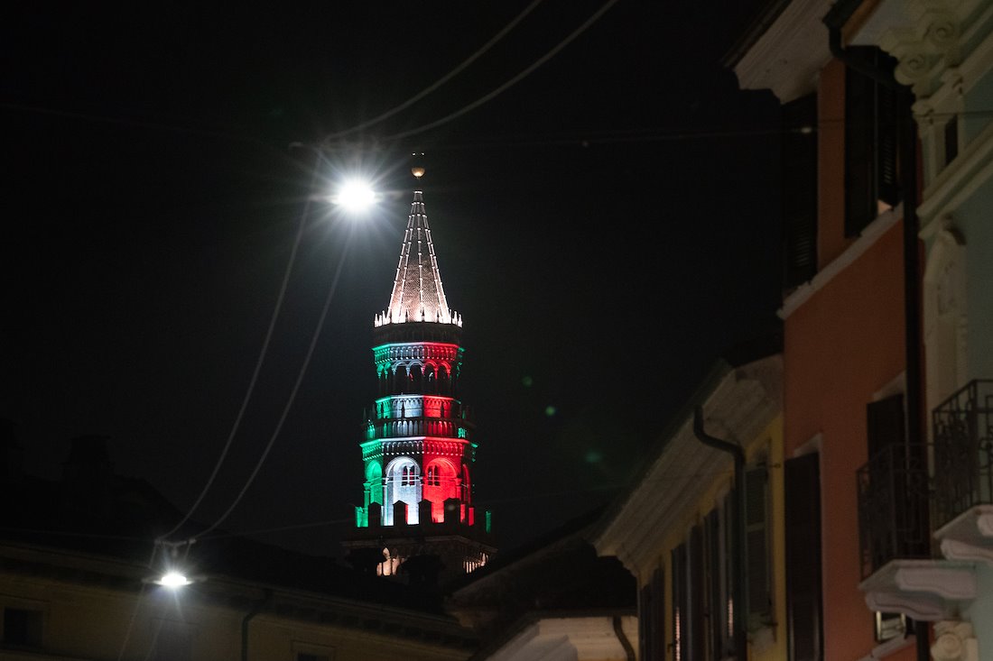Cremona's belltower, Il Torrazzo, is lit with the colors of the Italian flag as a symbol of hope and solidarity for the Italian people during the COVID-19 crisis.